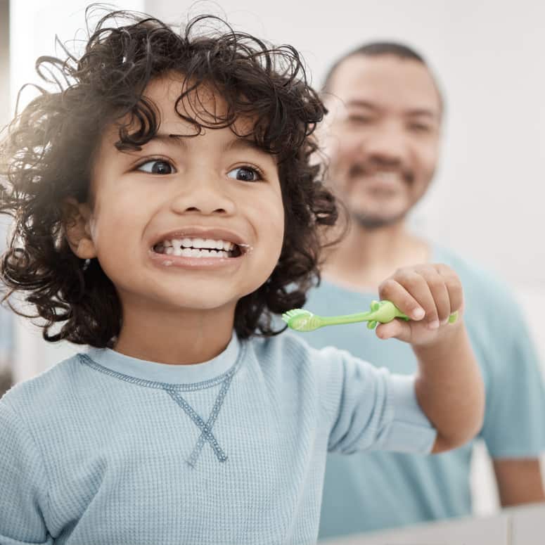 Little boy brushing his teeth